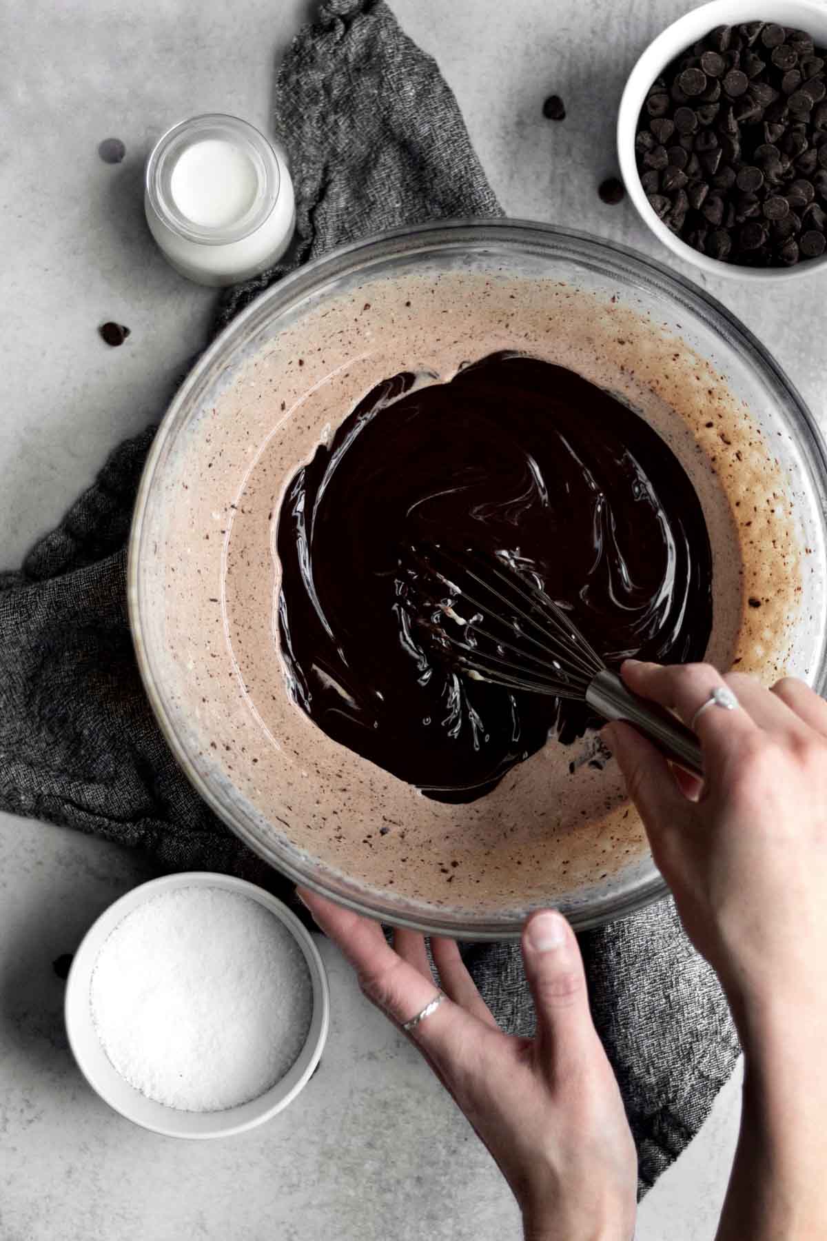 Whisking the chocolate mixture and heavy cream together.