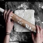 Using a rolling pin on gluten free Puff Pastry Dough.