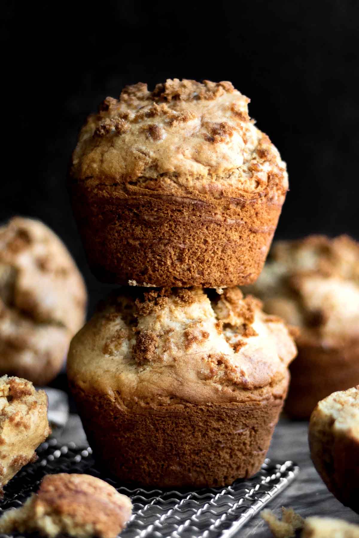 A stack of two Jumbo Gingerbread Muffins with brown sugar crusted tops.