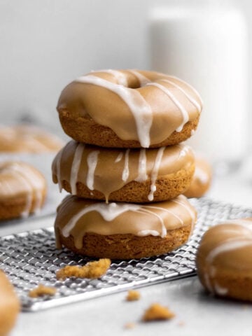 A stack of three gluten free and nut free Pumpkin Donuts.