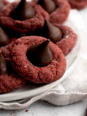 Gluten free Red Velvet Kiss Cookies on a plate.
