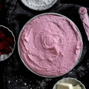 Pink Raspberry Buttercream swirled in a bowl.