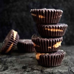 A stack of 4 gluten free and nut free Wow Butter Cups tiered unevenly.