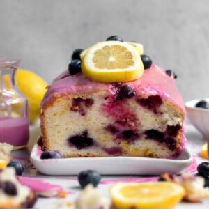 Blueberry Lemon Loaf cut in half showing the blueberry stained insides.