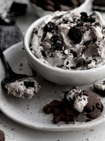 A bowl with chocolate cookie crackers and Oreo Dip.
