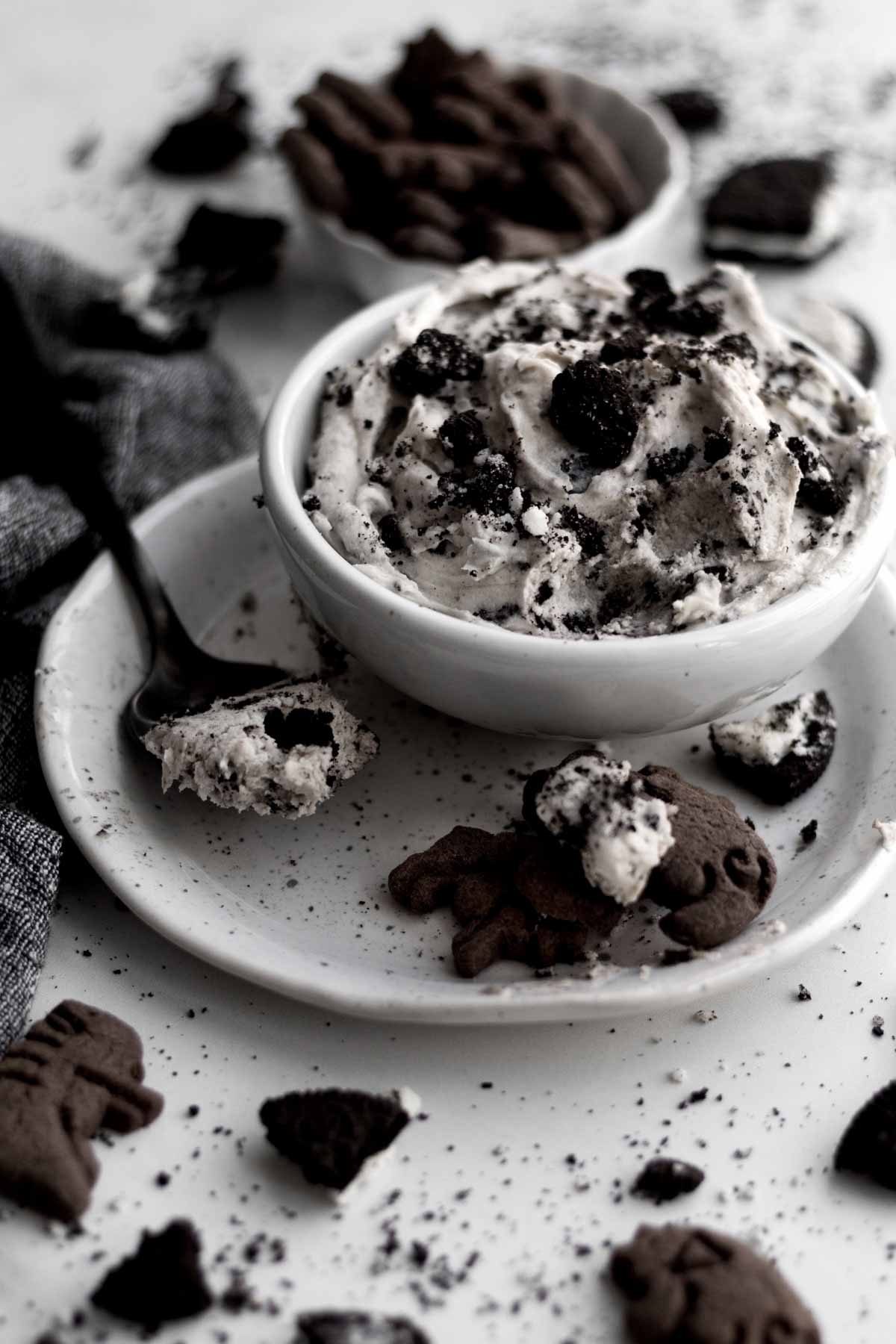 A bowl with chocolate cookie crackers and Cookies and Cream Dip.