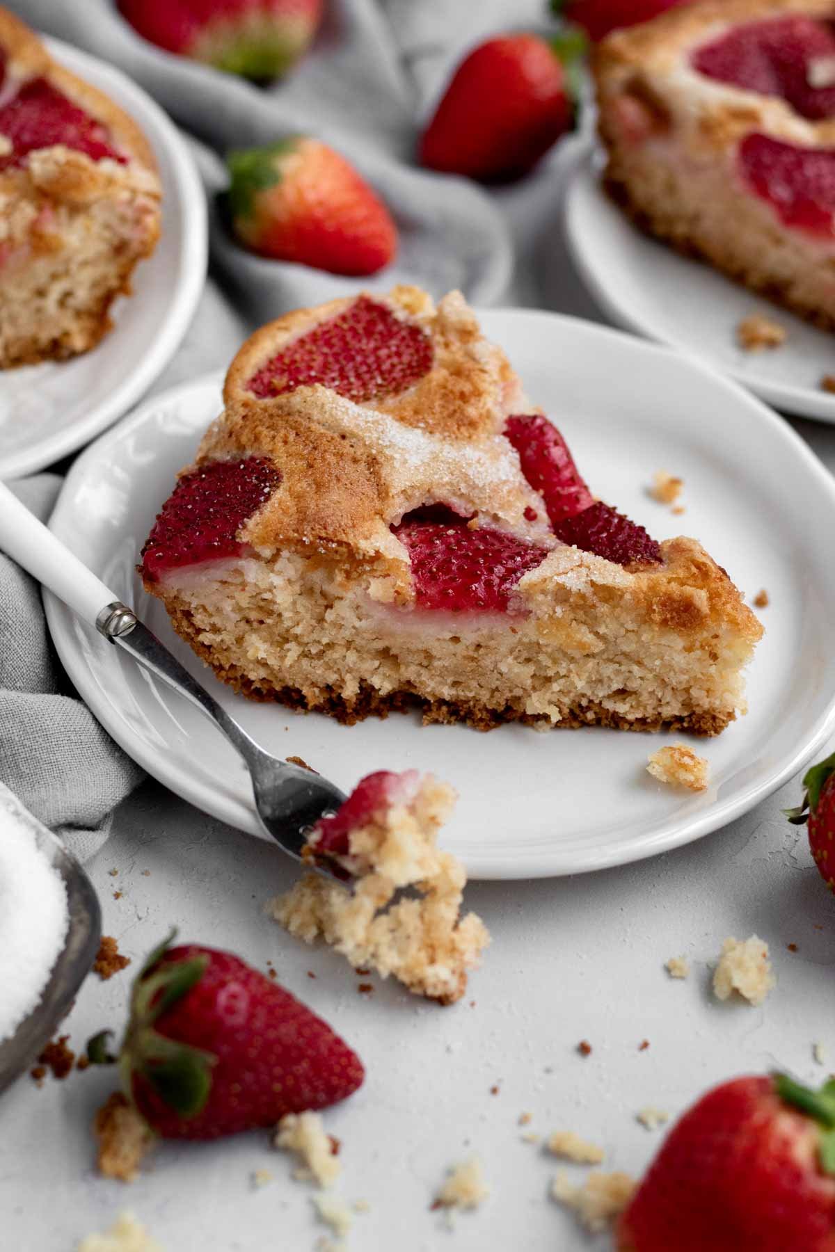 A slice of delicious Eggless Strawberry Cake on a plate.