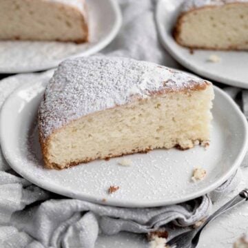 Light and airy, this Irish Tea Cake sits covered in powdered sugar.