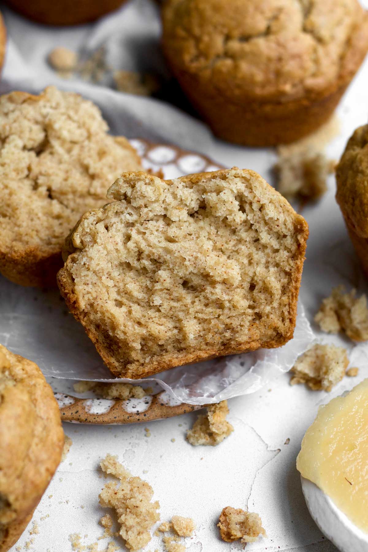 A delicious halved Gluten Free Applesauce Muffin basking on a plate ready for breakfast.