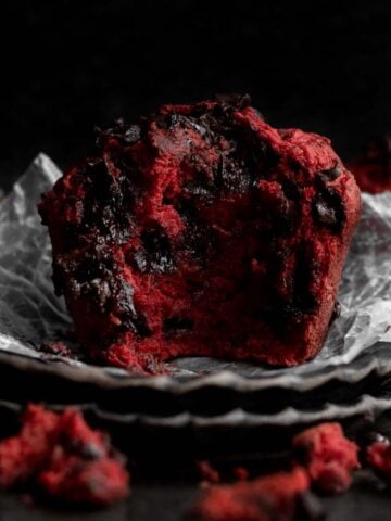 This delicious Red Velvet Muffin is bitten in half.