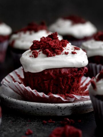A gluten free Red Velvet Cupcake with the wrapper down.