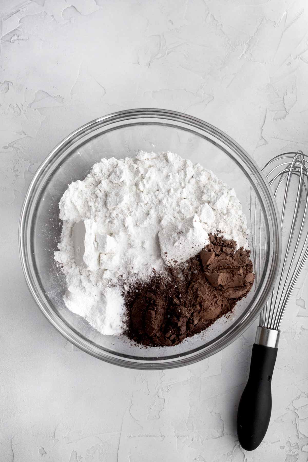 Flour, baking soda, cocoa powders, baking powder and salt in a bowl.