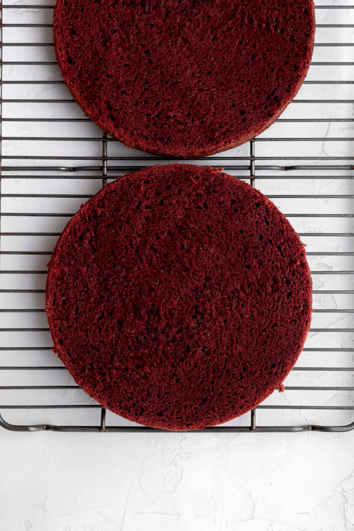 Red velvet cakes cut in half horizontally.