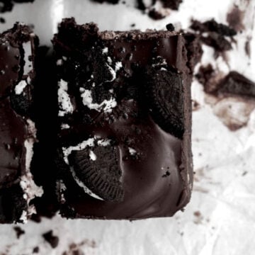 A closer look at broken up sandwich cookie infused with the brownie.