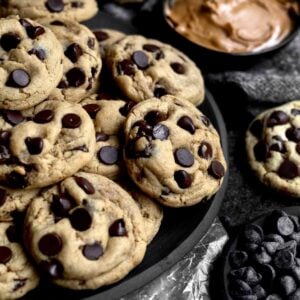 A black plate full of Wow Butter Chocolate Chip Cookies.