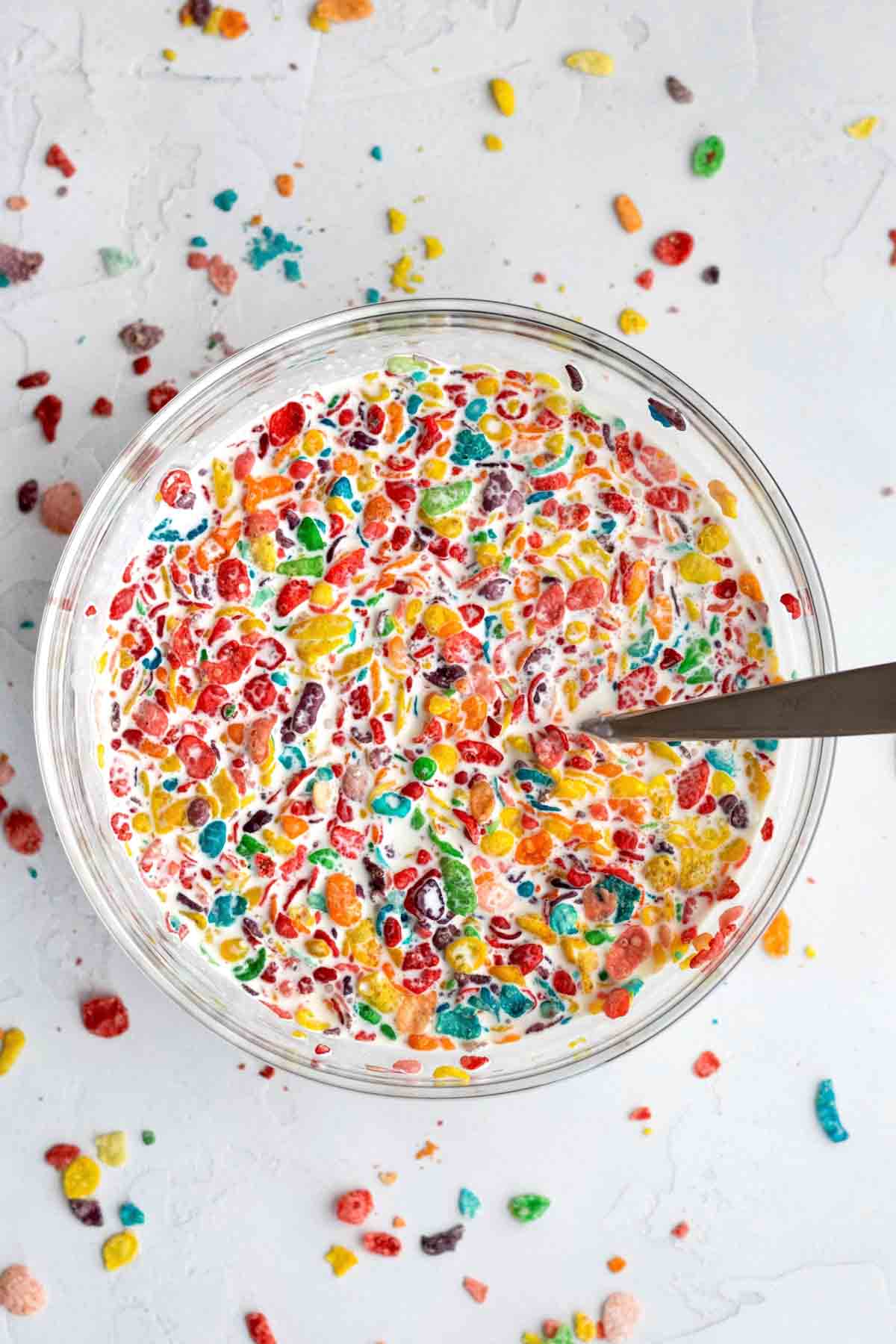 A bowl of Fruity Pebbles in condensed milk.