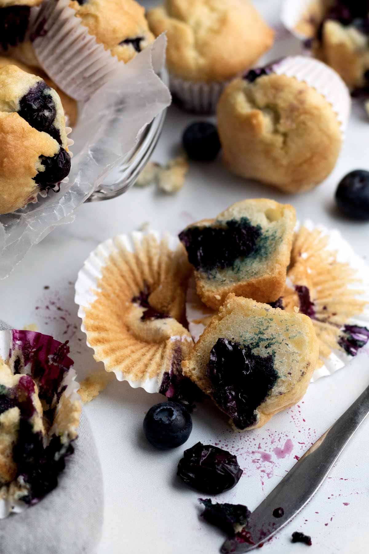 A blueberry muffin sliced in half.