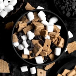 A bowl with chopped gluten free graham crackers, marshmallows and chocolate chips.
