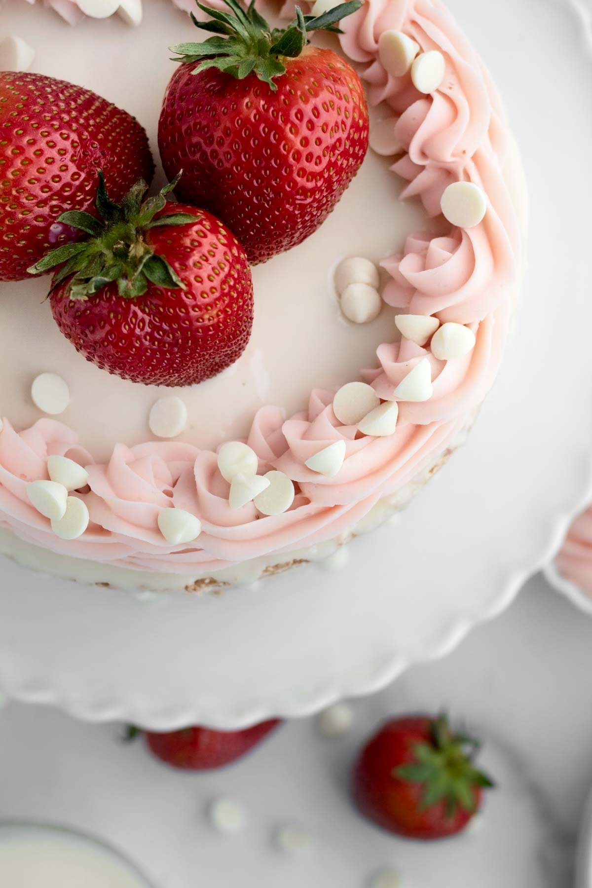 Looking down at the dance of frosting and white chocolate chips.