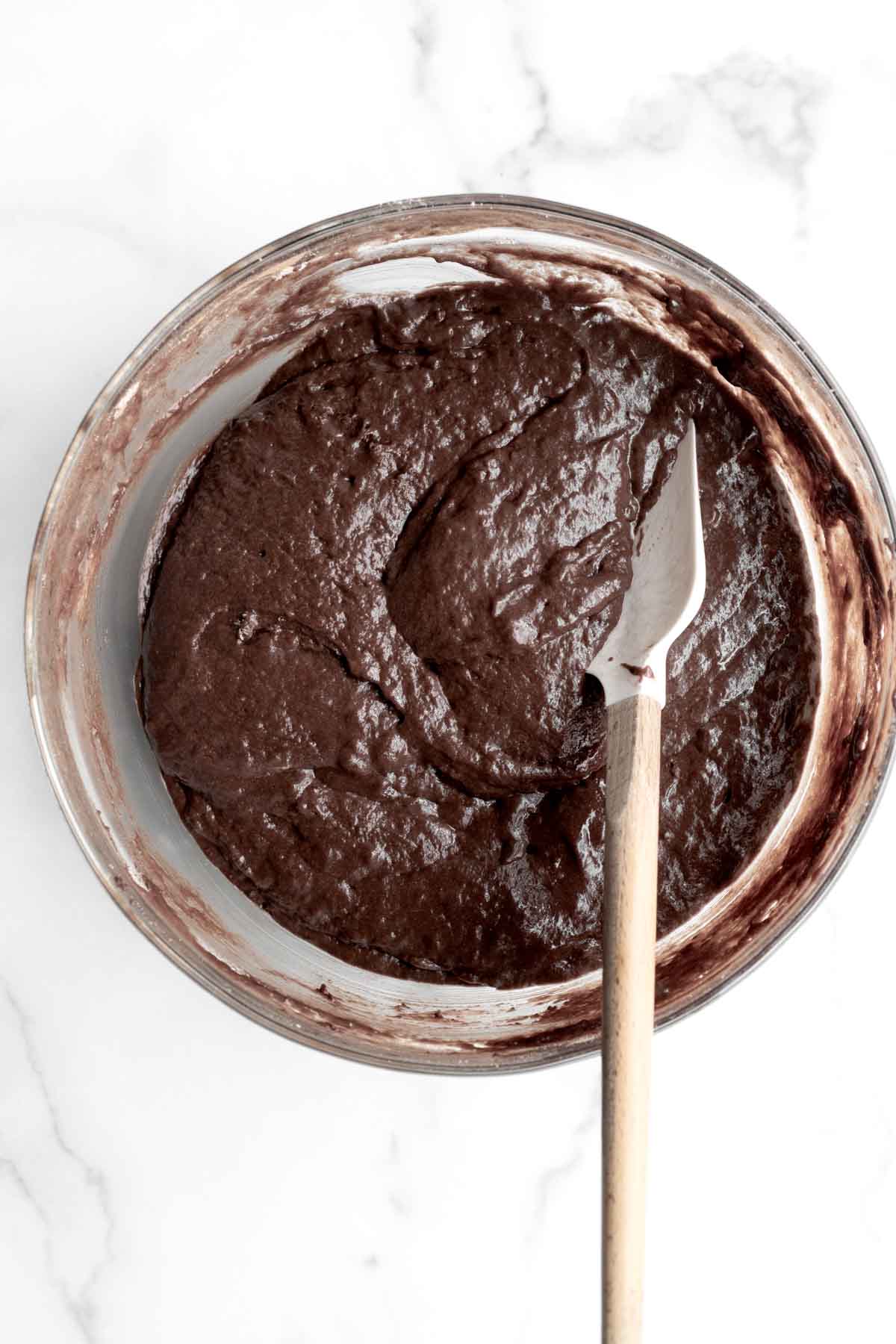 Mixing the chocolate batter in a bowl with a whisk.