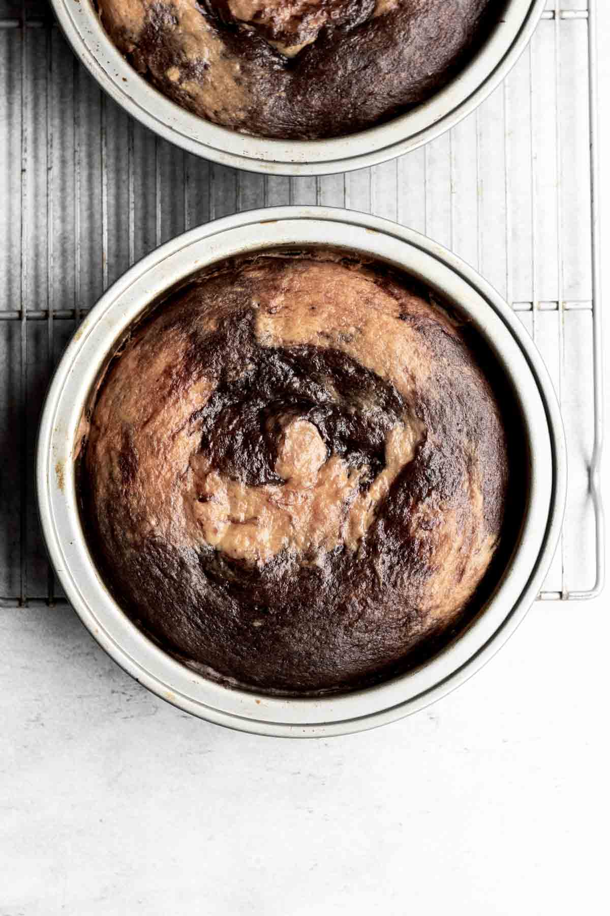 Marble cake risen from the oven in tins.