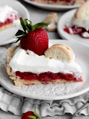 A stout gluten free No Bake Strawberry Pie slice on a plate.