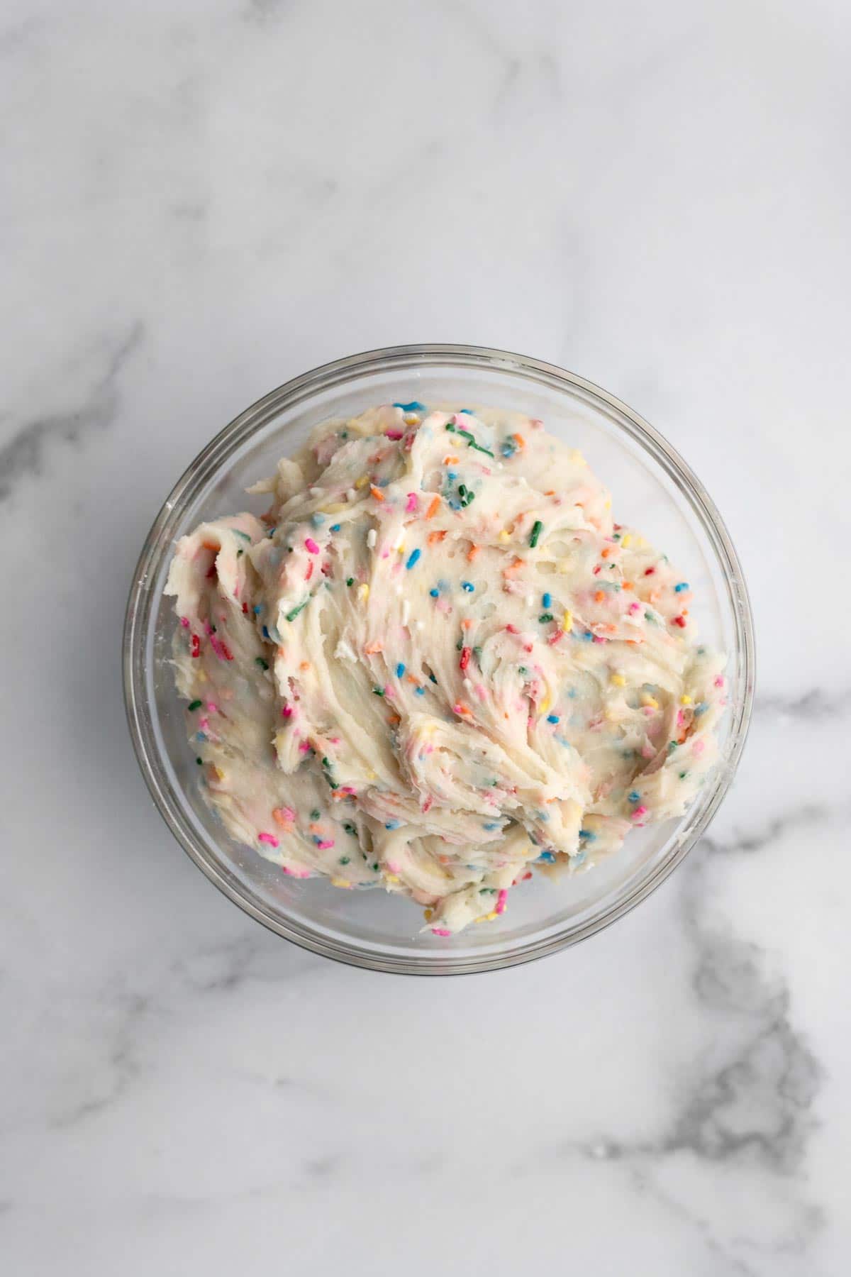 Sugar cookie batter with sprinkles mixed throughout.