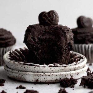 An Eggless Chocolate Cupcake with a bite taken out.