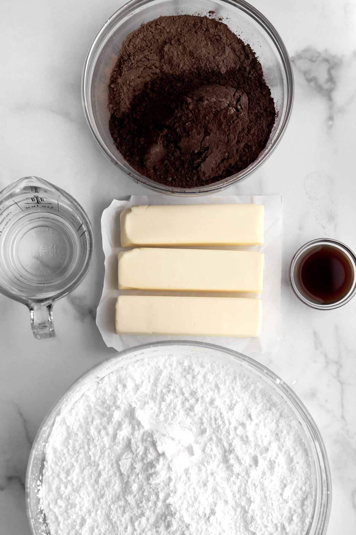 Cocoa powder, 3 sticks of butter, vanilla, water and confectioners’ sugar.