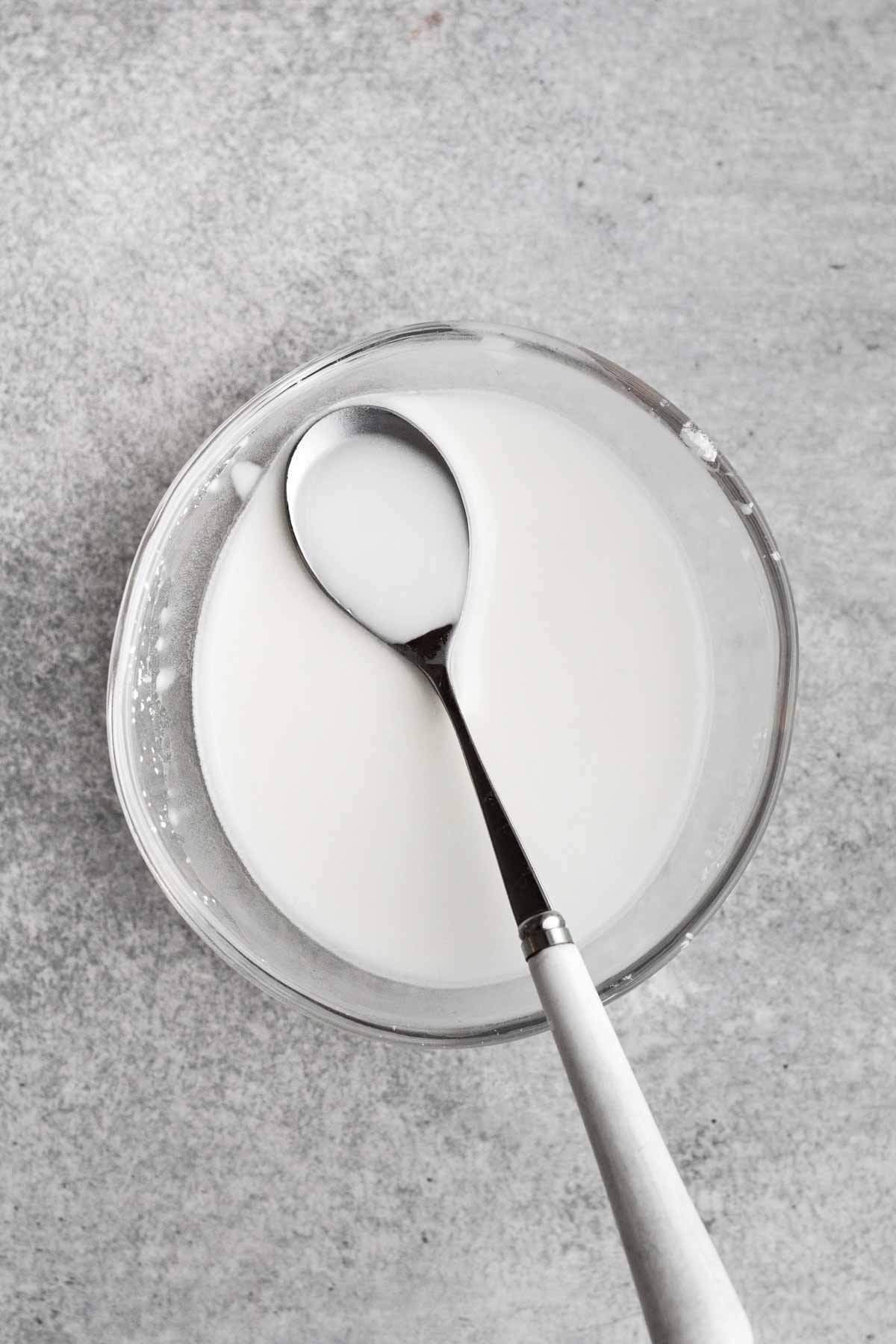 Cornstarch and water in a bowl mixed thoroughly.