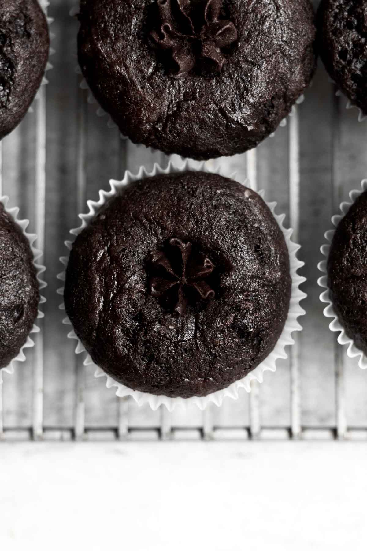 Filling the holes with chocolate frosting.