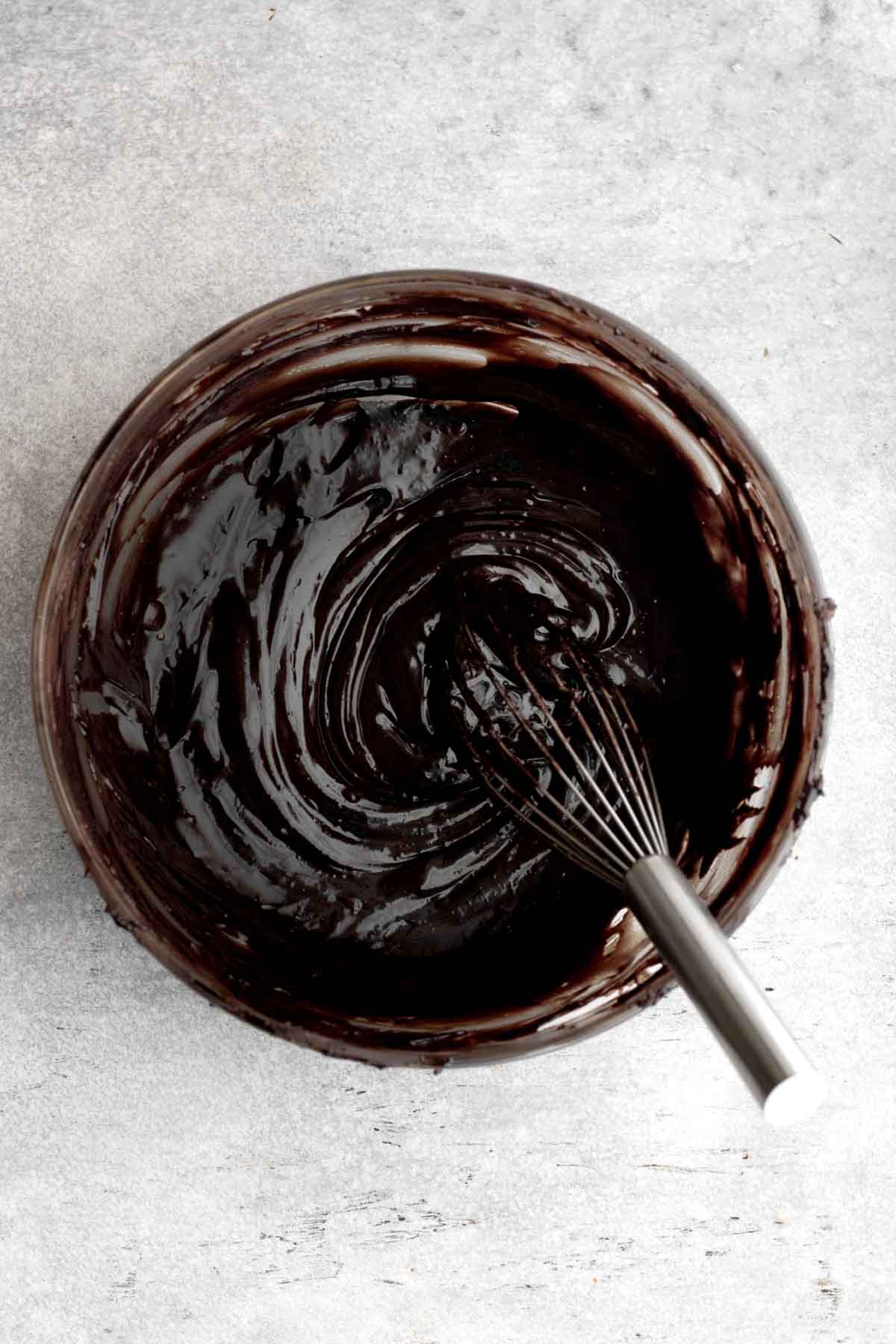 Whisking the cocoa powder and melted chocolate together.