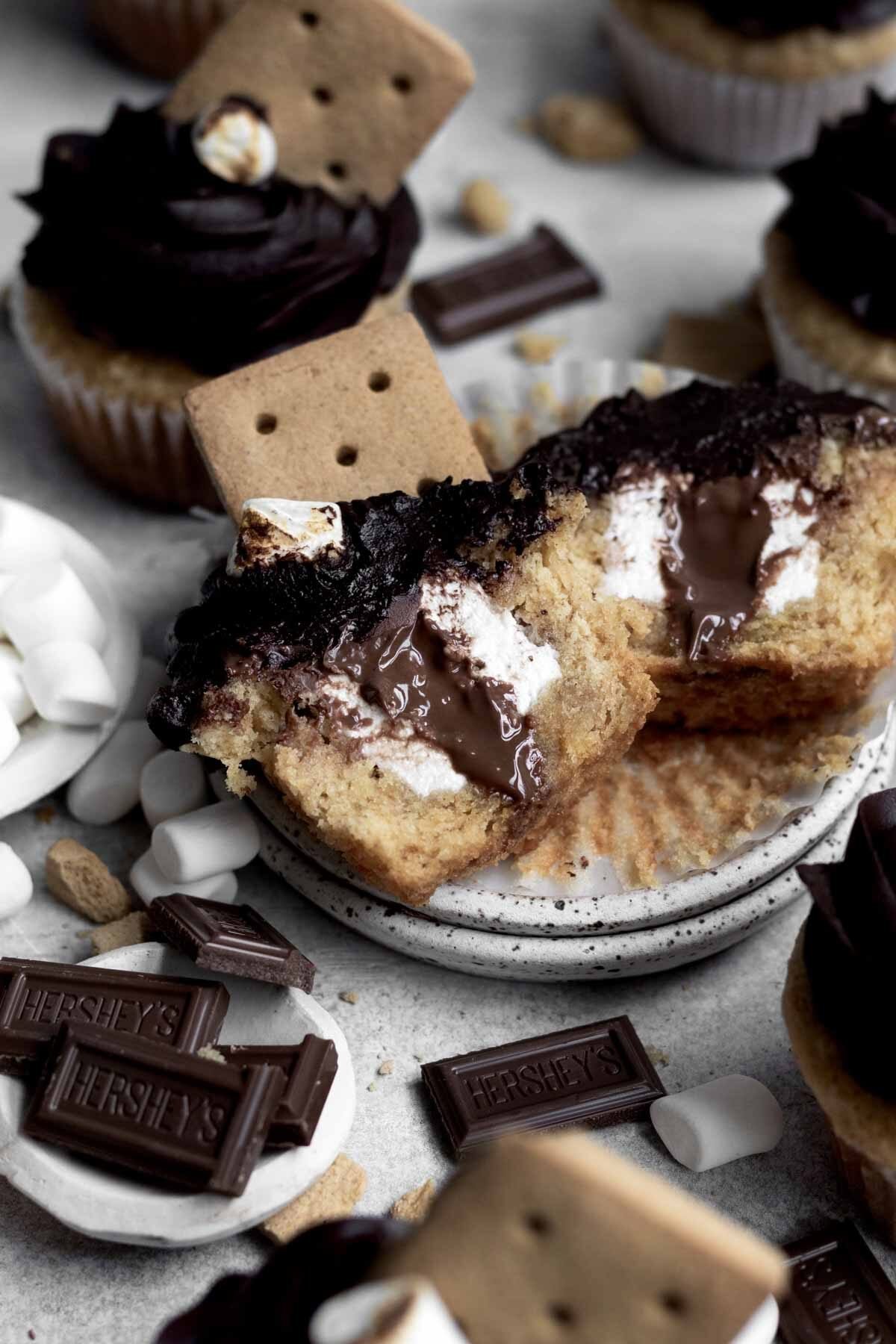 S’mores cupcakes sit in reverent silence with one split in half.