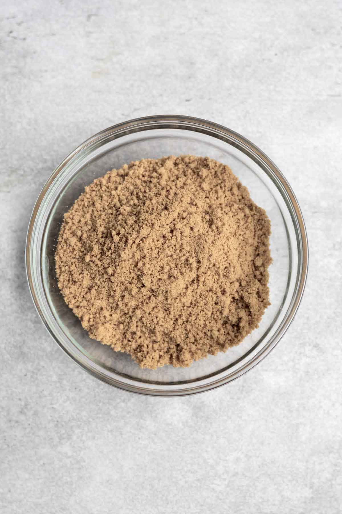 Gluten free graham cracker broken into a sand like consistency.