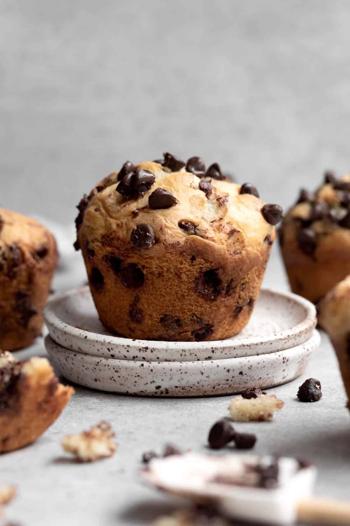 A fresh muffin on clay dishes higher than the rest.