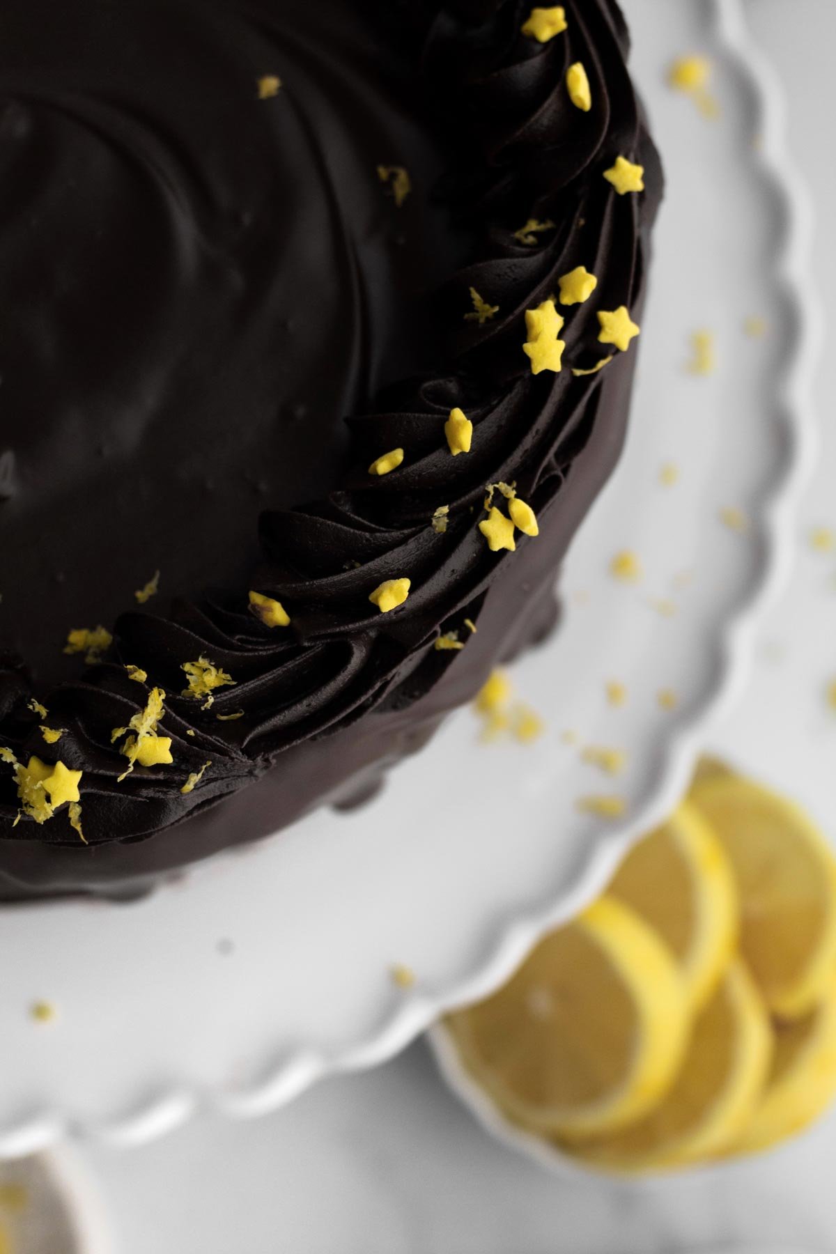 The ribbons of frosting adorned with yellow star sprinkles and lemon zest.