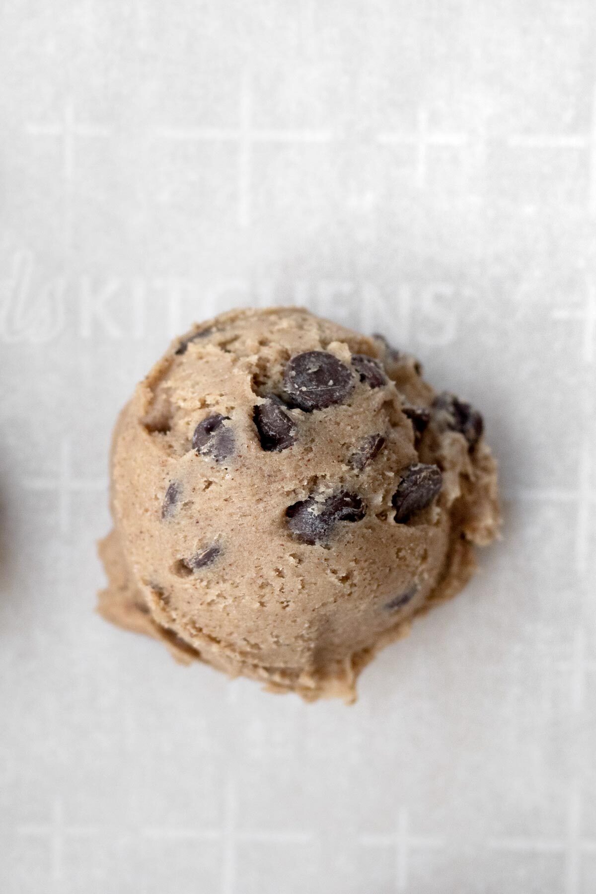 A ball of chocolate chip cookie batter.