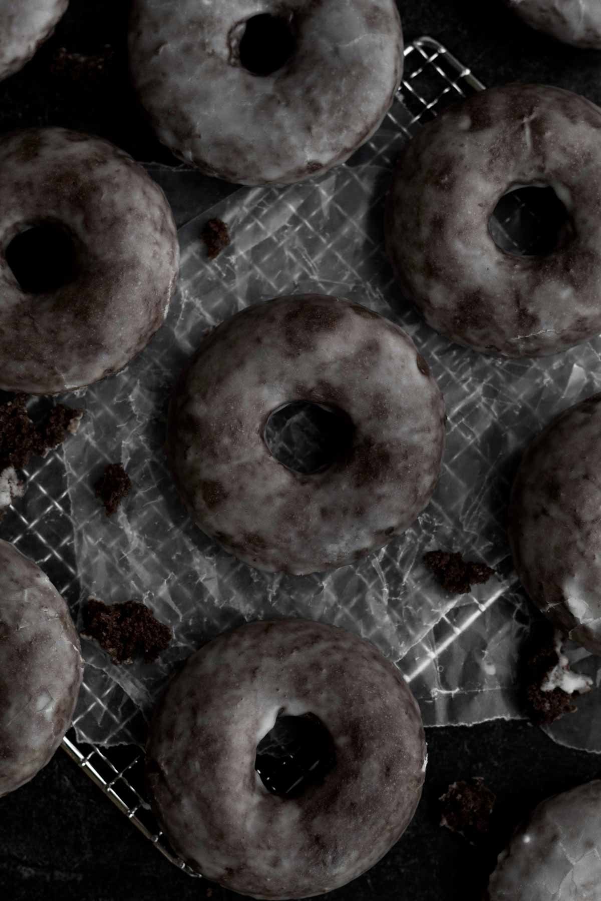 Looking down at the cloudy vanilla glaze on these donuts.