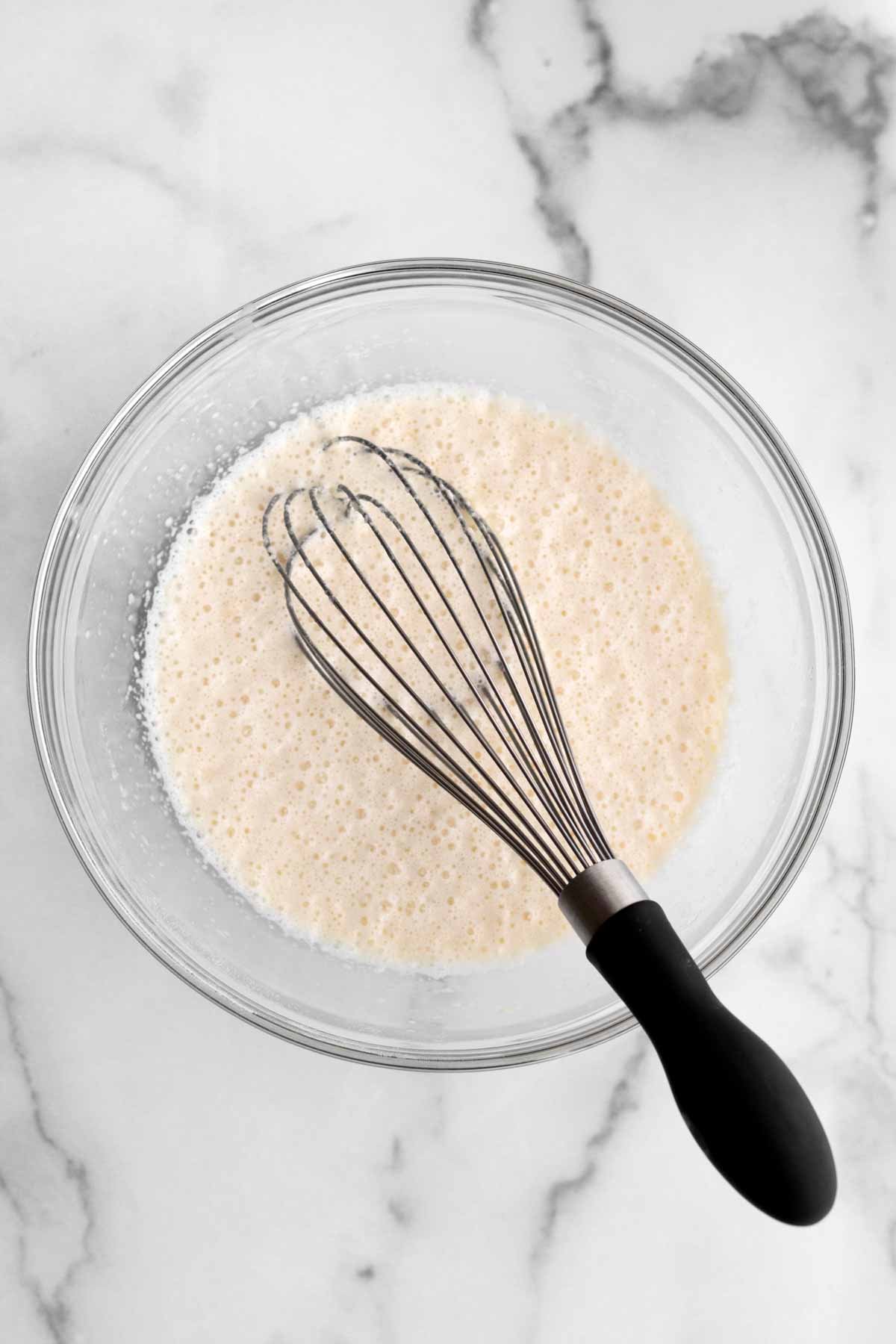 A whisk with the wet ingredients.