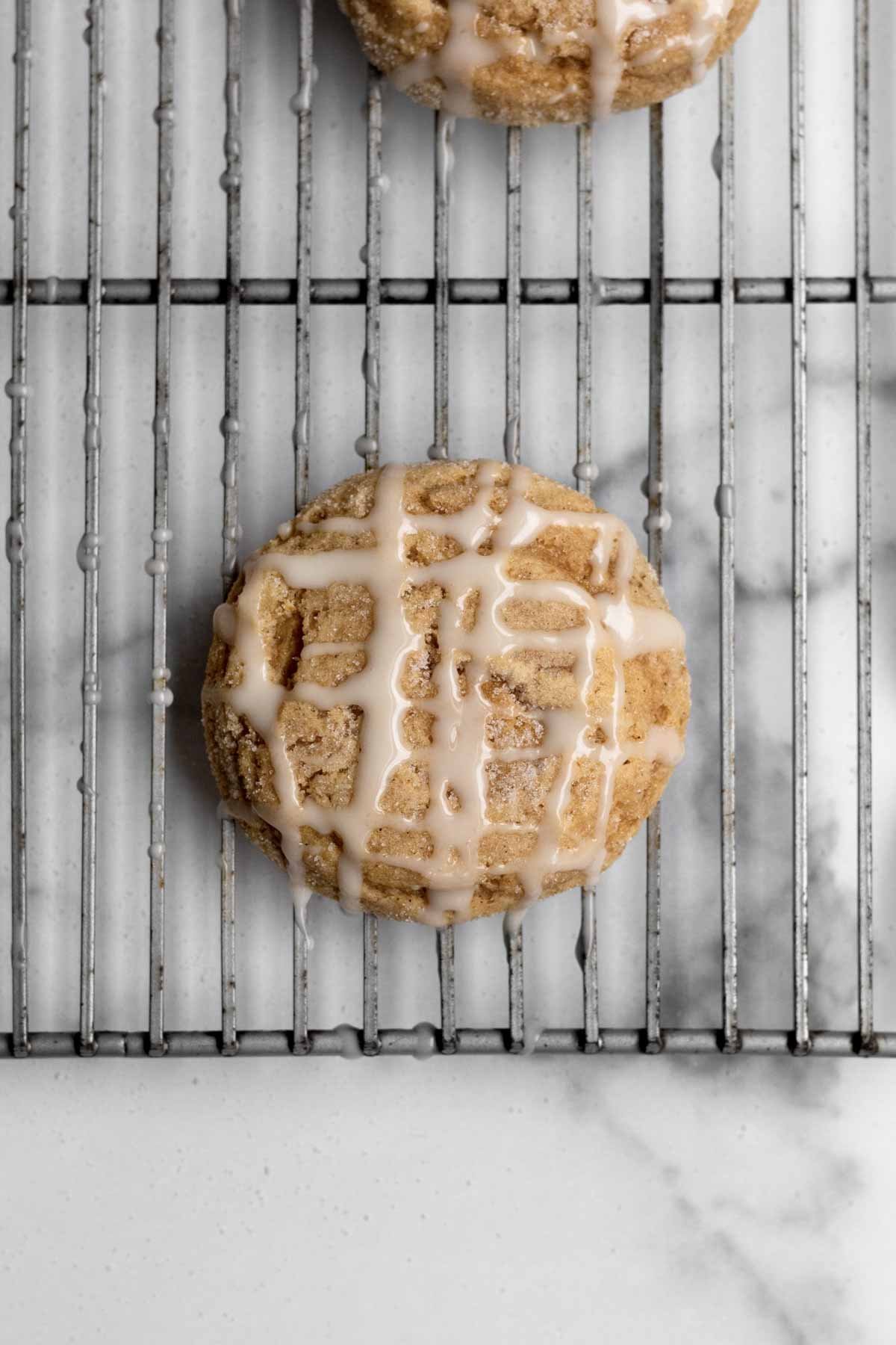 A crosshatch pattern of glaze on a cookie.
