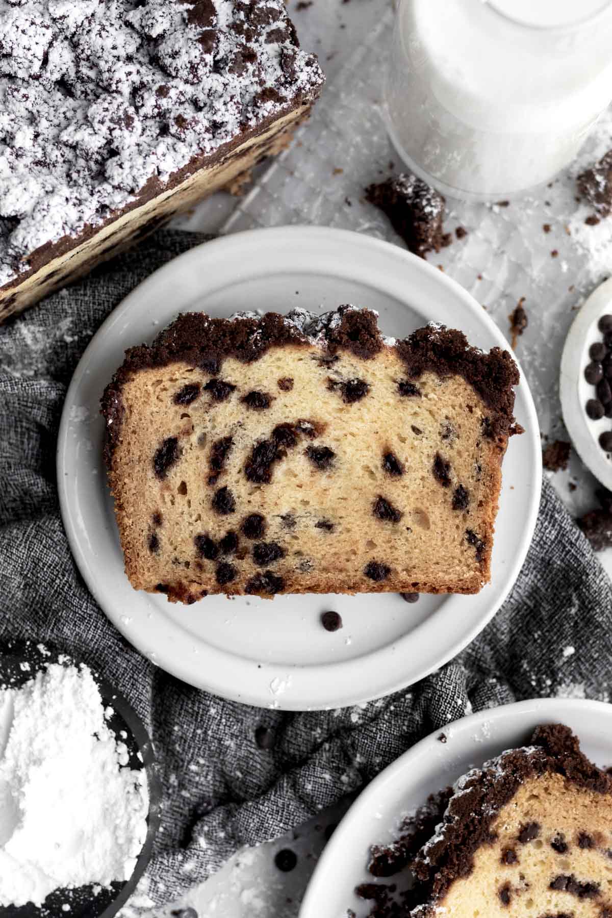 A slice of Chocolate Chip Loaf Cake on a plate.
