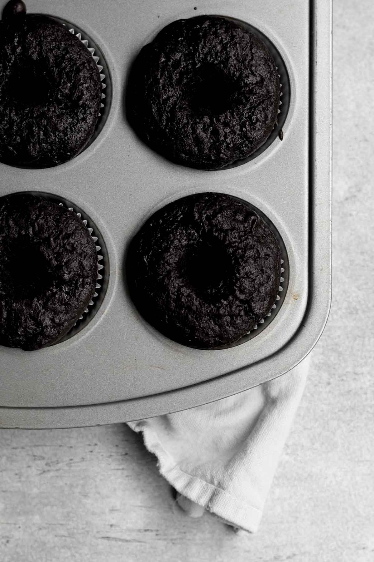 Holes dug into the center of the cupcakes.