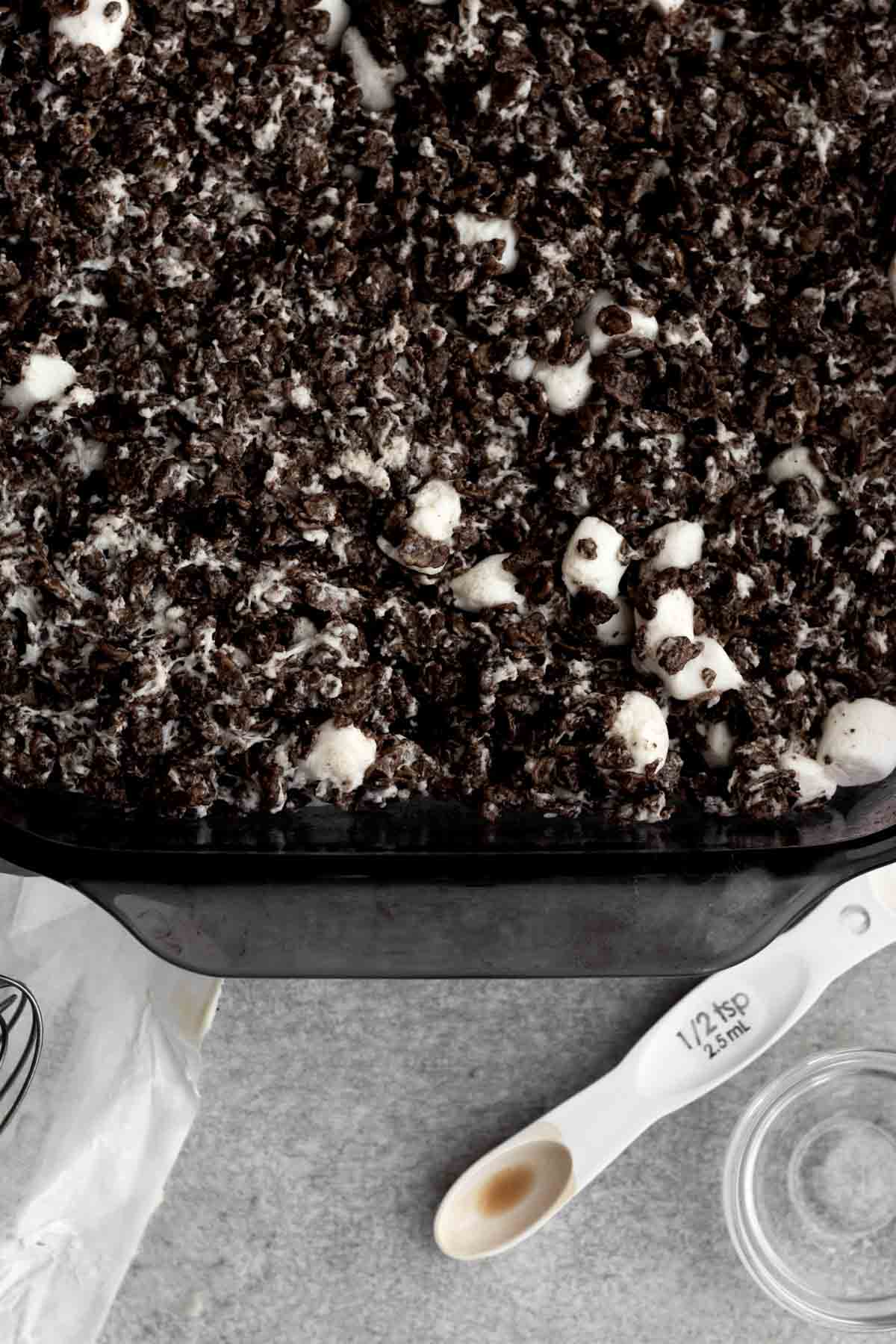 Filling a baking dish with the mix.