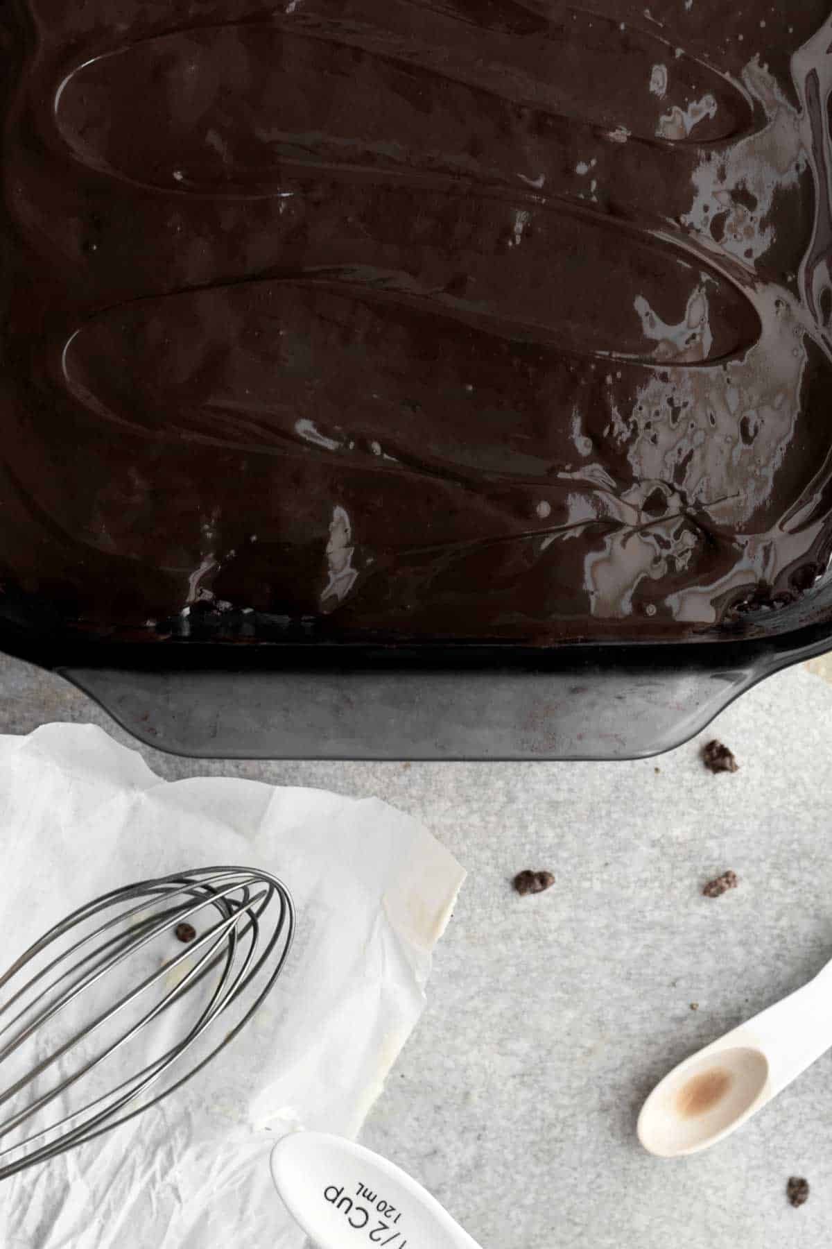 Adding a layer of warm chocolate on top.