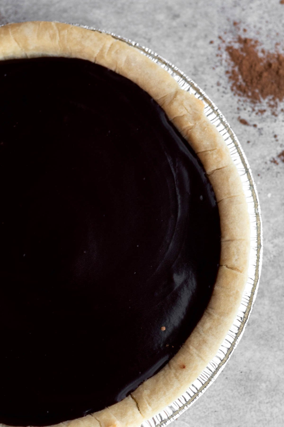 Smooth pudding fills the pie crust.
