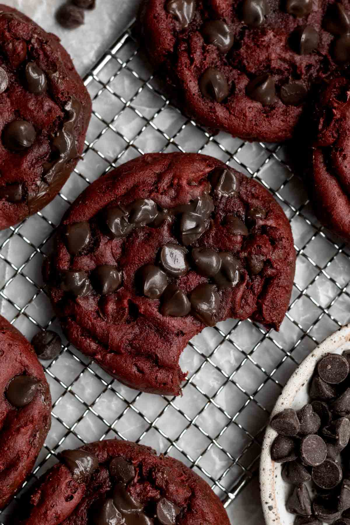Soft and red chocolate chip cookies on a cooling tray.