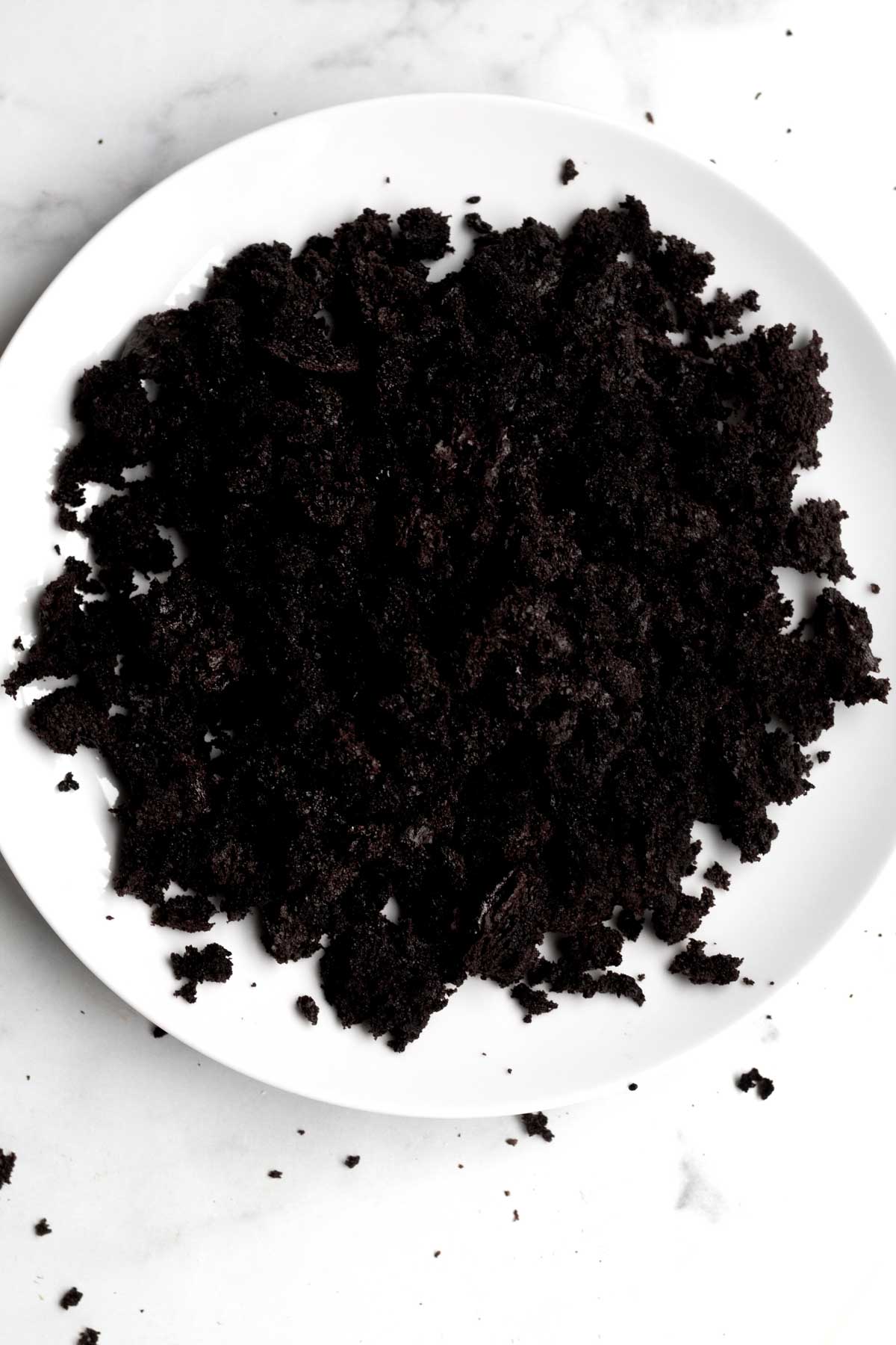 A plate of chocolate cake crumbles.