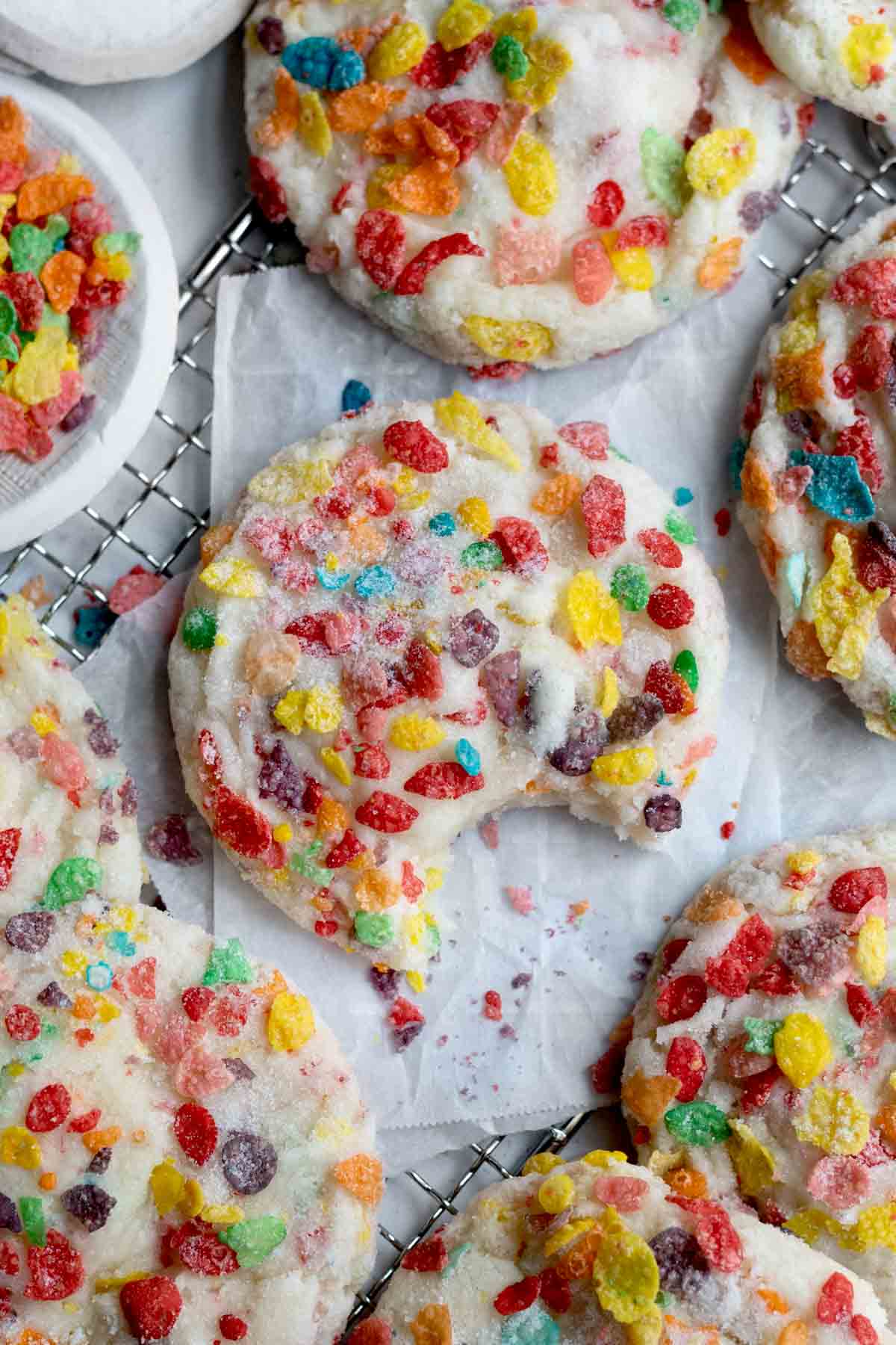 Fruity Pebbles Cookies with a bite taken out.