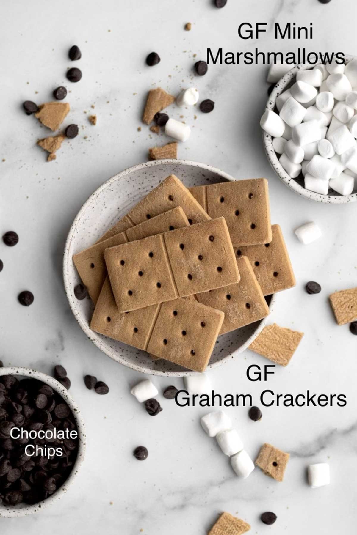 Chocolate chips, gluten free graham crackers, gluten free mini marshmallows in separate containers.