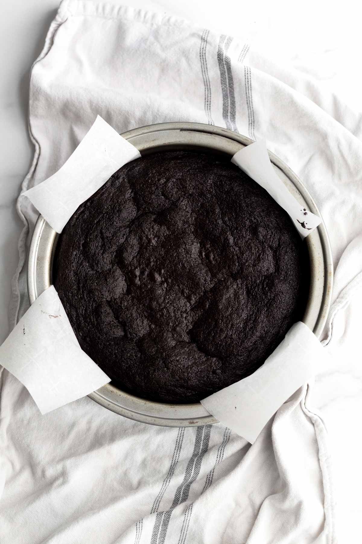 Fresh oven baked chocolate cake in the cake pan.
